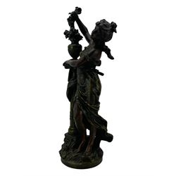 After L & F Moreau - Spelter table lamp in the form of a female figure next to a pedestal on circular naturalistic base H55cm