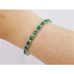 18ct white gold oval cut emerald and round brilliant cut diamond bracelet, stamped, total emerald weight 7.50 carat, diamond weight 0.46 carat