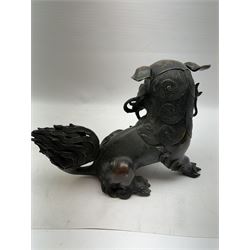 Bronze dog of foo, modelled with one paw placed upon ball, H18cm