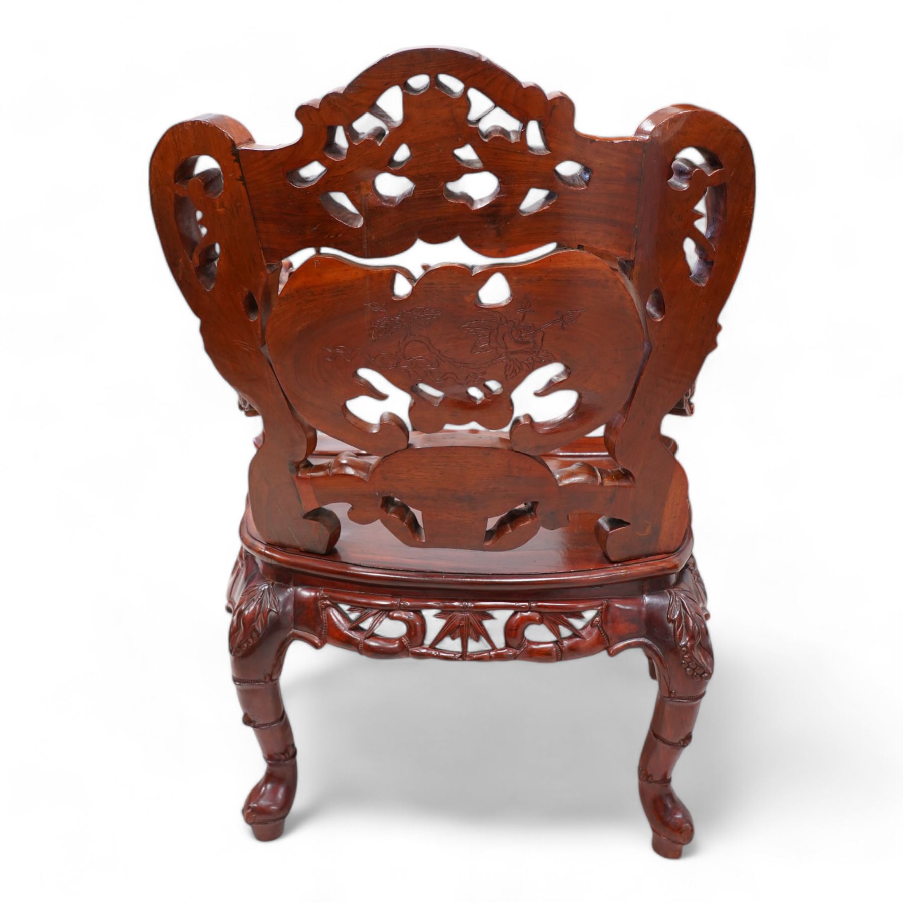 Pair of Japanese carved hardwood throne chairs, pierced and dragon carved cresting over pierced back panel carved with bat, extending dragon carved arms over panelled seat, the seat rails pierced and carved with trailing branches and foliate motifs, on cabriole supports 