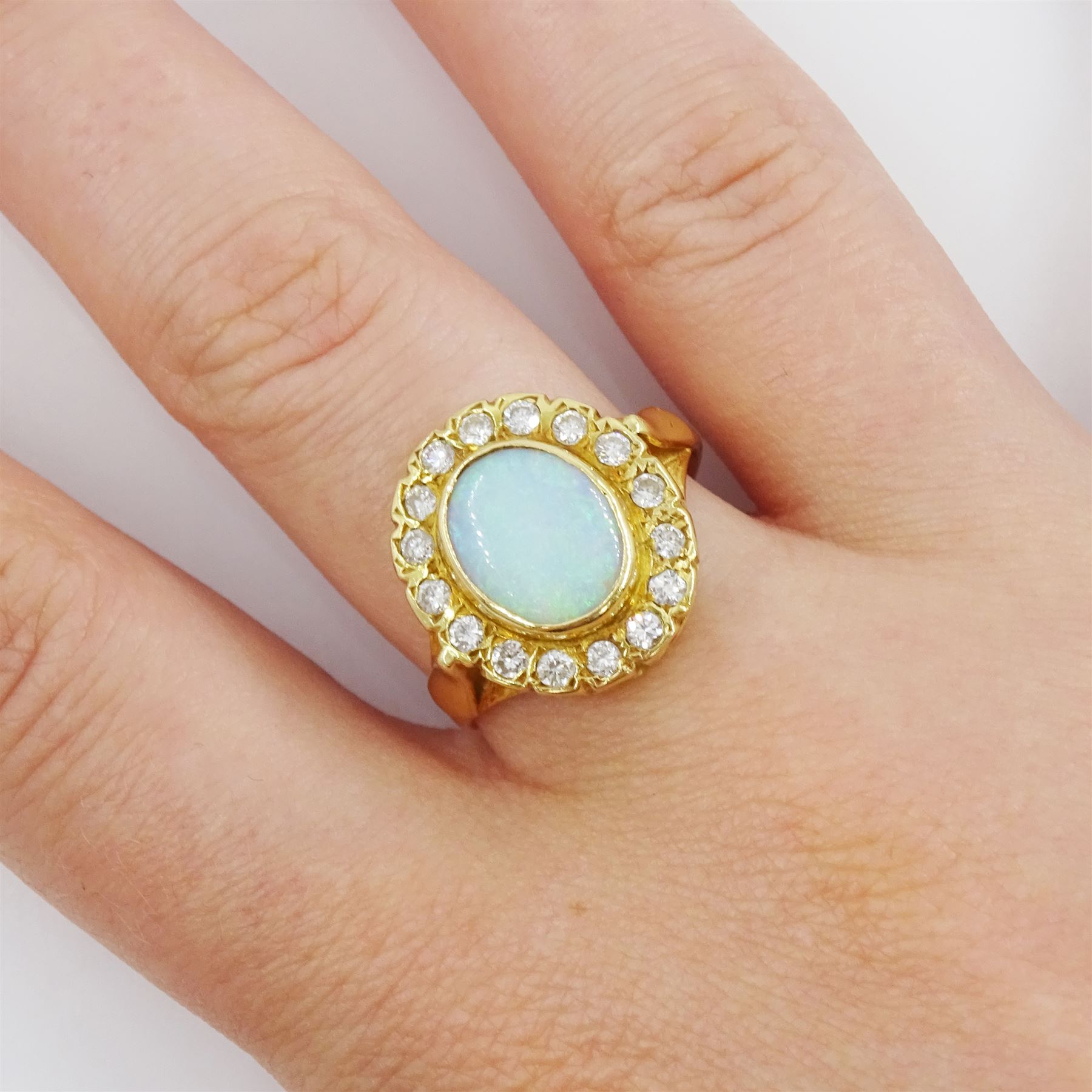 18ct gold opal and round brilliant cut diamond cluster ring, London 1989