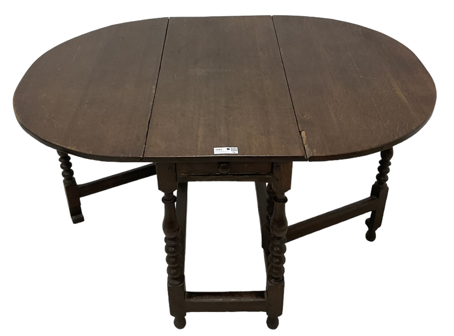 18th century country oak drop-leaf table, oval top, fitted with single drawer, raised on double gate-leg action bobbin-turned supports, united by stretchers