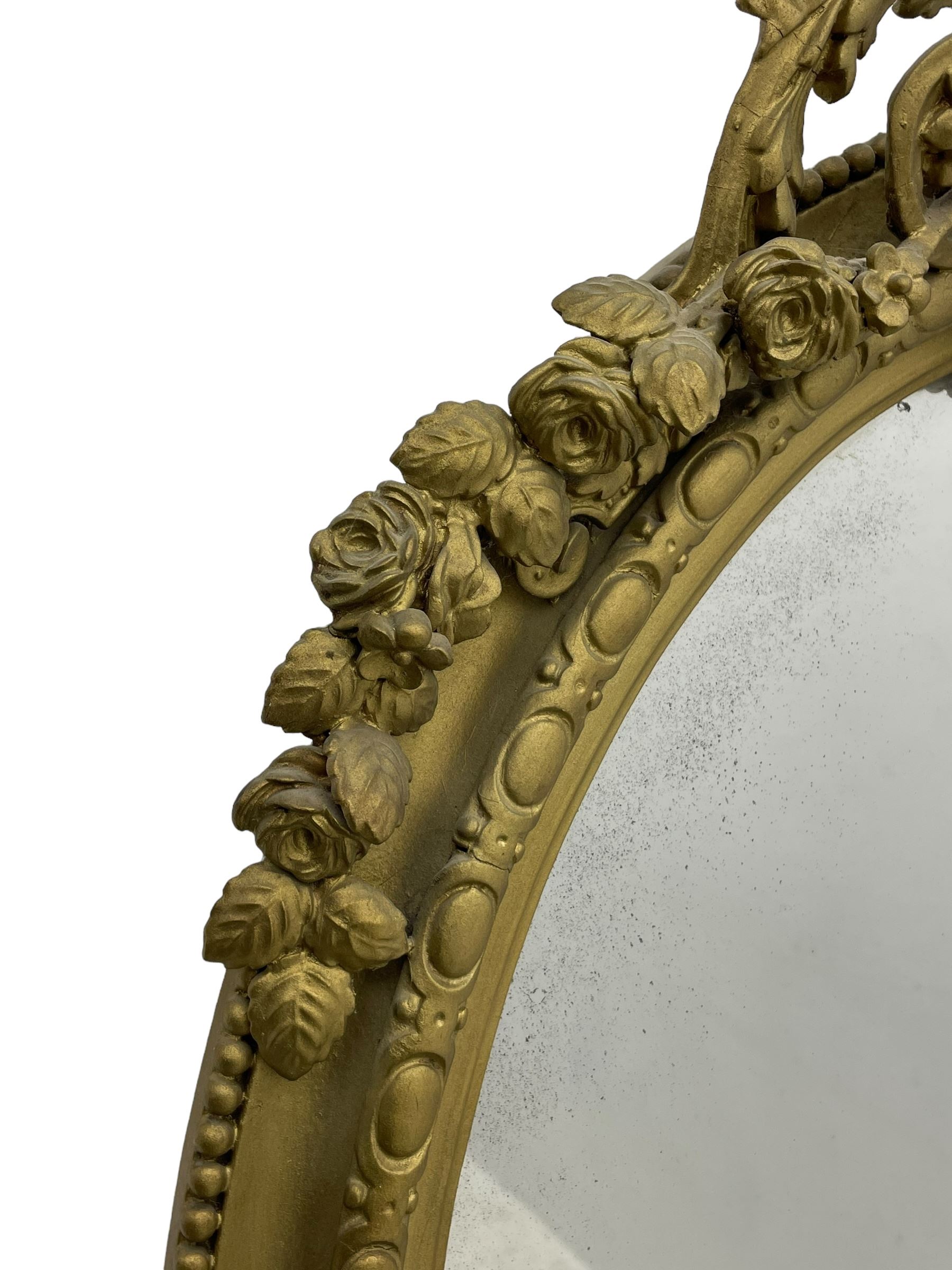 19th century giltwood and gesso girandole wall mirror, the raised pediment decorated with ribbon tie over curled acanthus leaves and flowerhead festoons, oval egg and dart moulded frame with outer bead, three projecting candle sconces in the form of scrolled acanthus leaves, lower shell motif with extending leaf decoration 