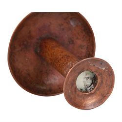 Large Arts & Crafts copper chamberstick, the circular dish with tall cylindrical stem, circular nozzle, and applied strap handle, the whole with hammered finish, with impressed mark beneath, H22cm