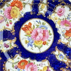 Pair of early 19th century plates, each painted with summer flowers within gilt fan shaped reserves, against a blue scale ground, unmarked, D19cm, together with a 19th century English porcelain plate, pattern no. 2/1078 (3)