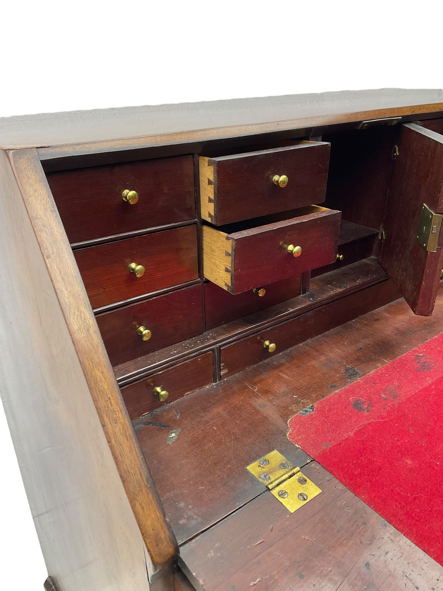 George III mahogany bureau, the fall front enclosing fitted interior, three graduating long drawers, on bracket feet