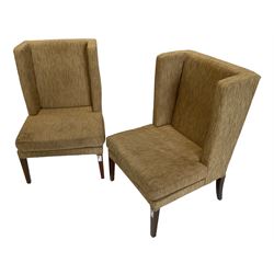 Two wing back armchairs, upholstered in oatmeal fabric