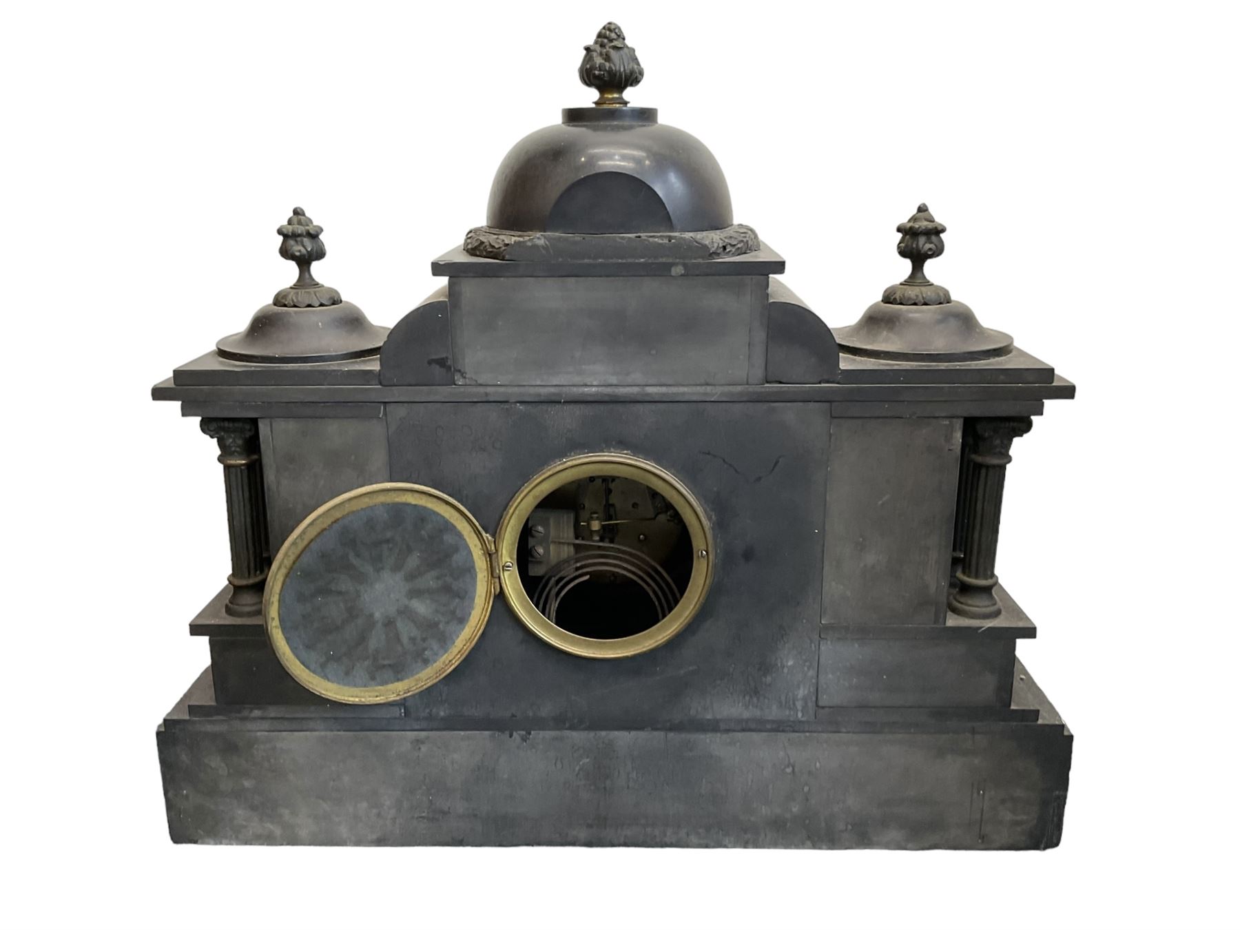 French - late 19th century Belgium slate 8-day mantle clock with conforming side temples, break front case with a central dome, recessed pilasters and a deep stepped plinth, glazed bezel with a brass dial, Arabic numerals and decorated centre, gong striking twin train movement with pendulum and key.