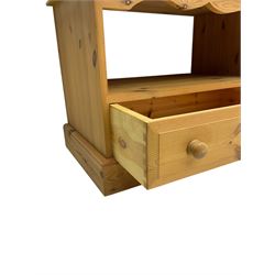 Pine television media unit, rectangular top with moulded edge, over open compartment and single drawer, on plinth base