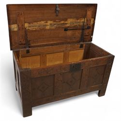 18th century oak blanket box, moulded rectangular hinged lid over three panel front, carved with stylised plant motifs and lozenges, on stile supports 