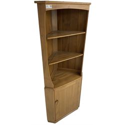 Ercol - mid-20th century '743C'  light elm corner cabinet, fitted with two open shelves over a single cupboard