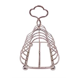 Victorian silver seven bar toast rack, each bar of trilobed form, with similar loop handle and upon four bun feet, hallmarked John Gilbert, Birmingham 1863, H16.5cm