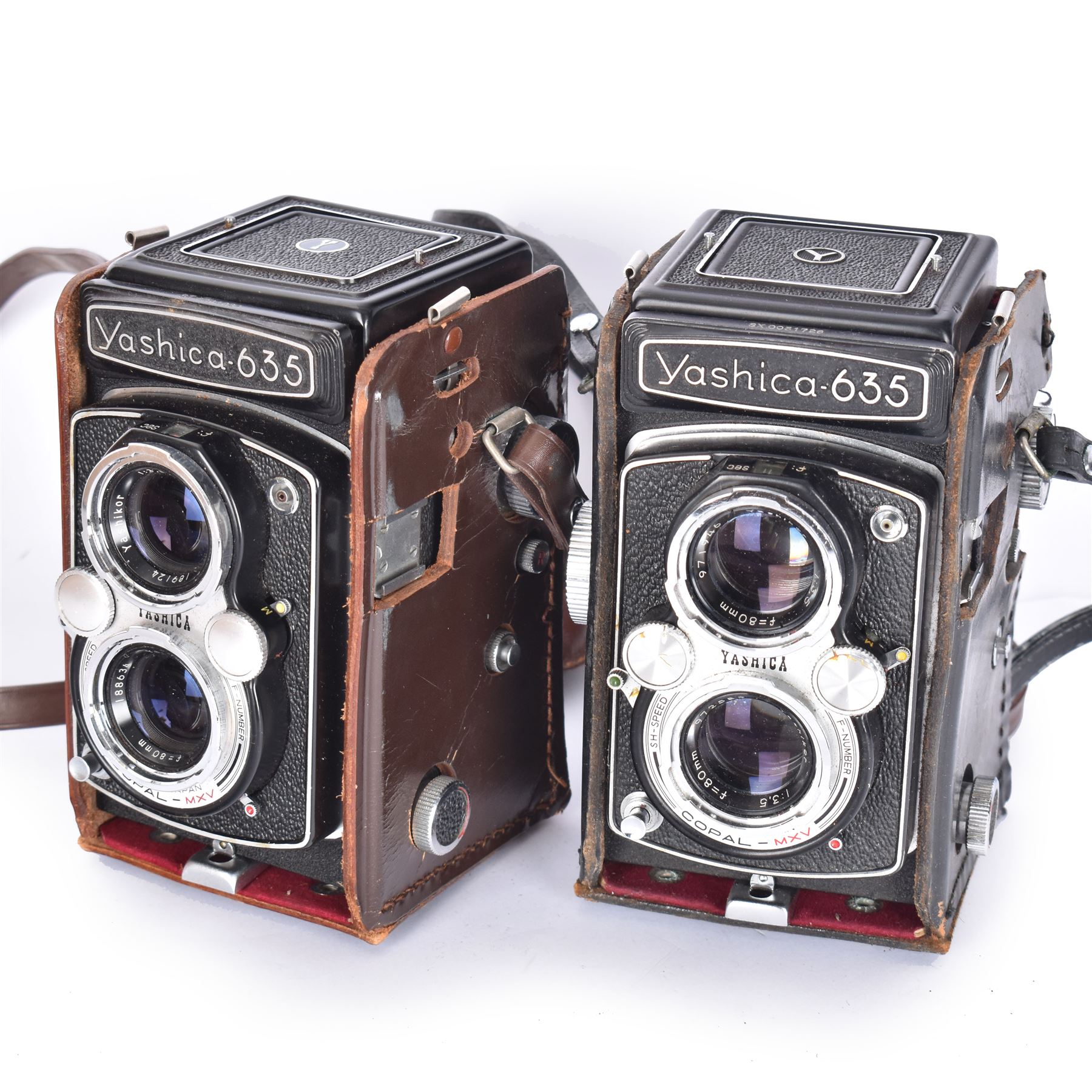 Two Yashica-635 Copal-MXV medium format TLR film cameras, circa 1970s, serial nos. ST 4041084 & SX 0031728, each with twin Yashikor 1:3.5 f-80mm lenses, in leather carry cases