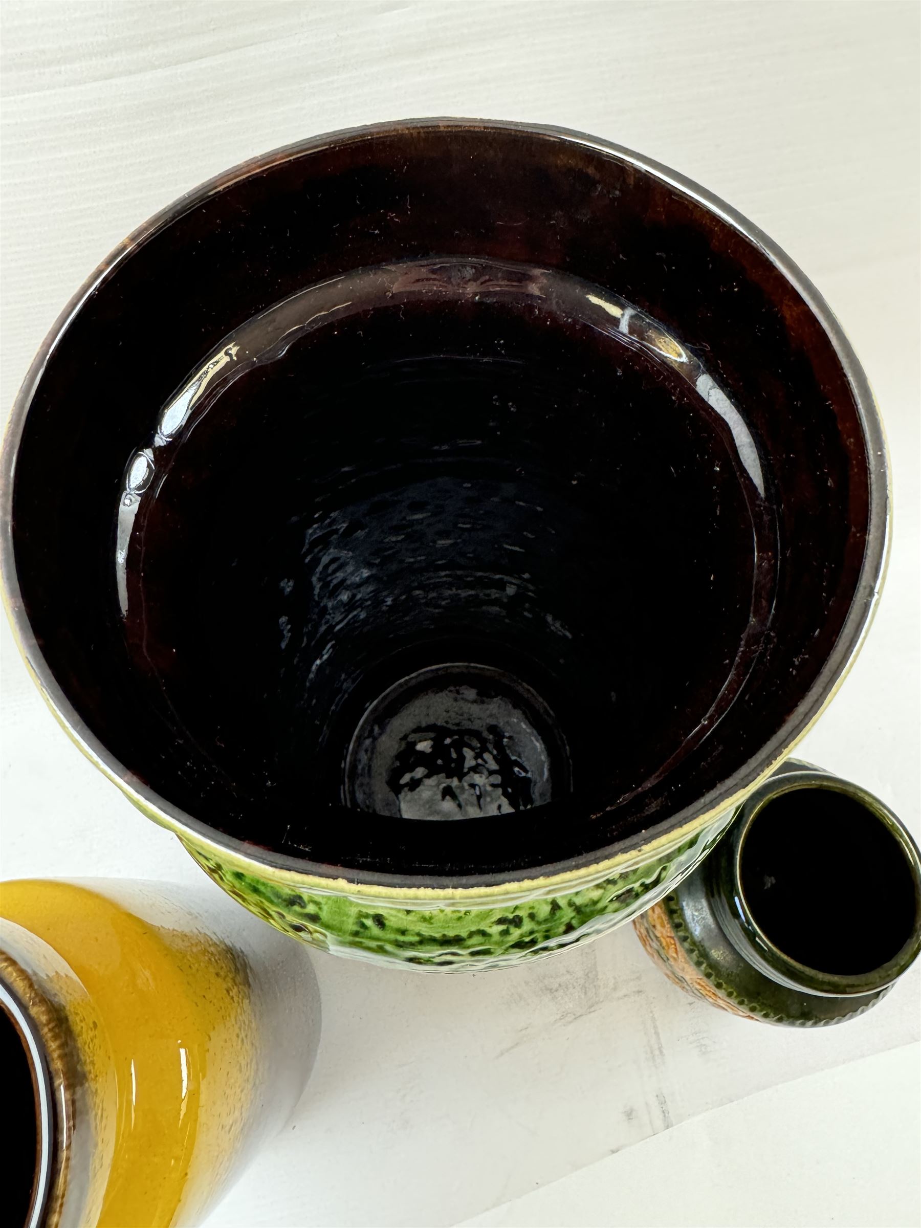 Three West German vases, to include orange and green example with floral decoration and a similar smaller example, tallest H40cm