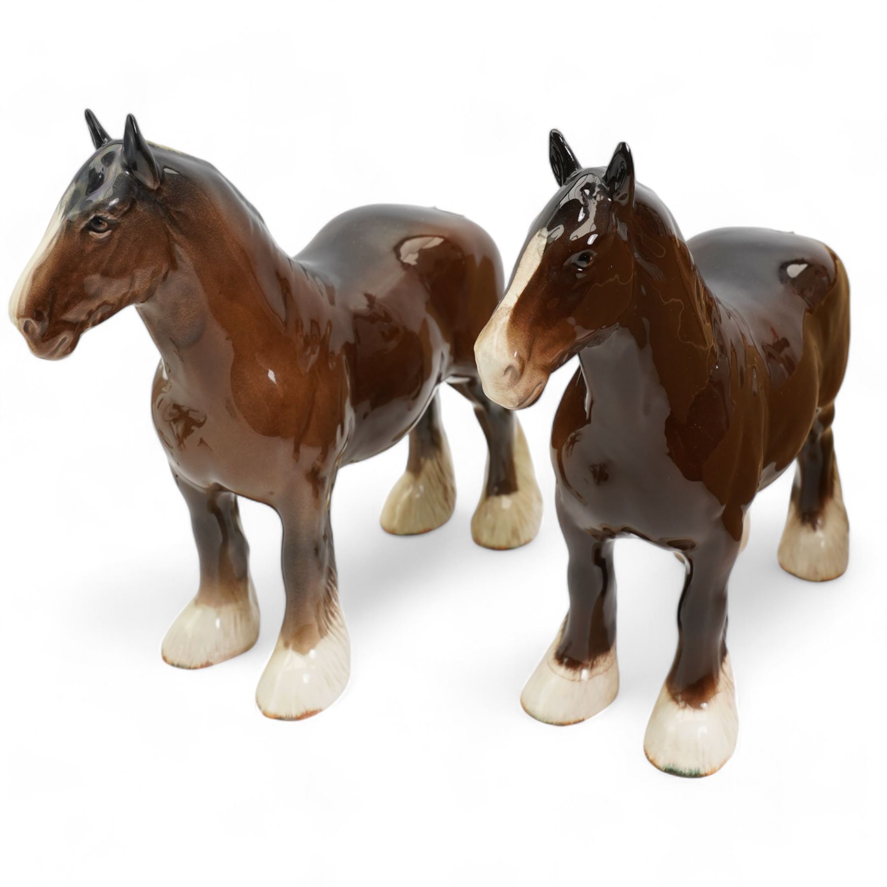 Group of Beswick horses and donkeys, including Connemara pony, a grey gloss stallion and foal, Black Beauty, another foal, two shire horses and two donkeys 