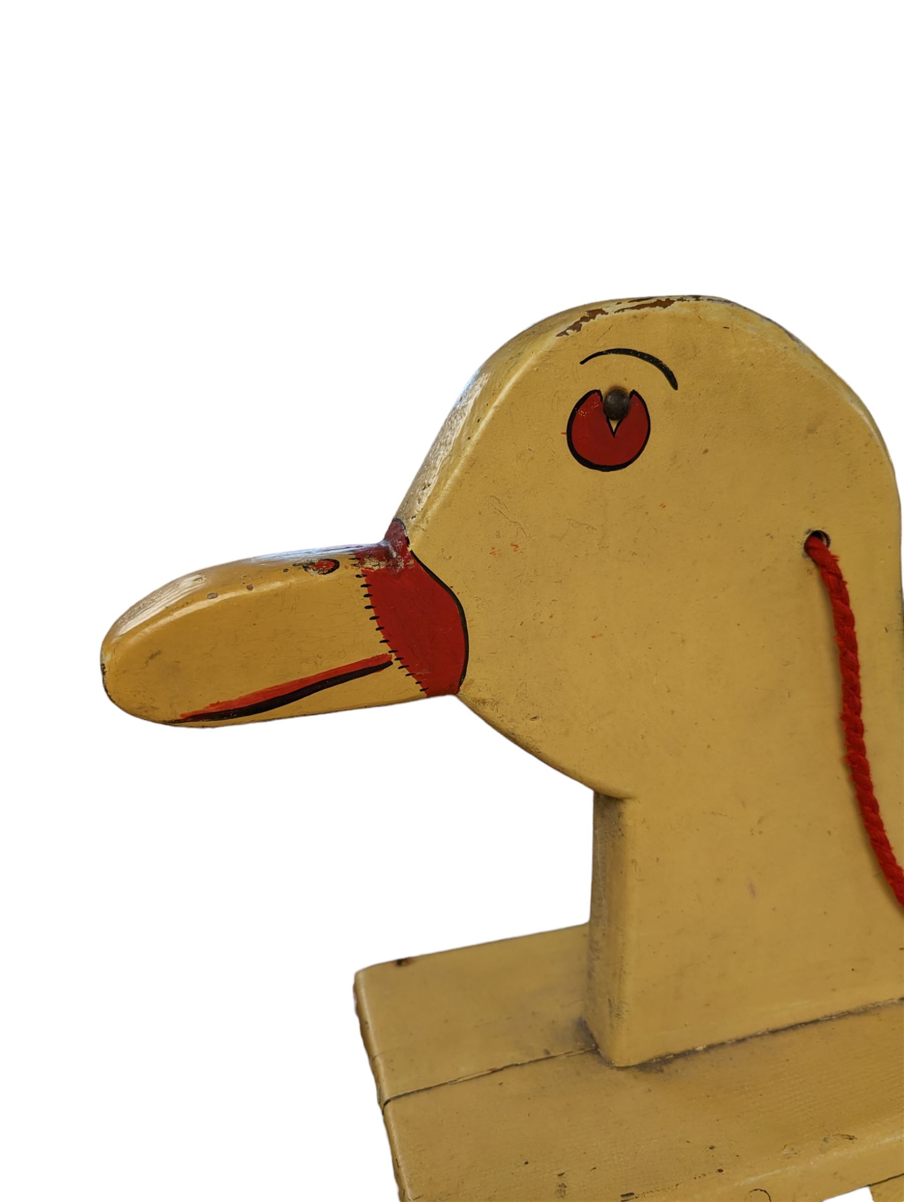 Mid 20th century rocking duck, painted in yellow with red details, H73cm, L79cm