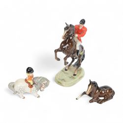 Three Beswick figures, comprising Huntsman on Rearing Horse no 868, Thelwell Angel on Hors...