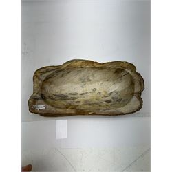 Polished petrified wood dish, some growth rings still visible, texture to edge, H5cm L24cm