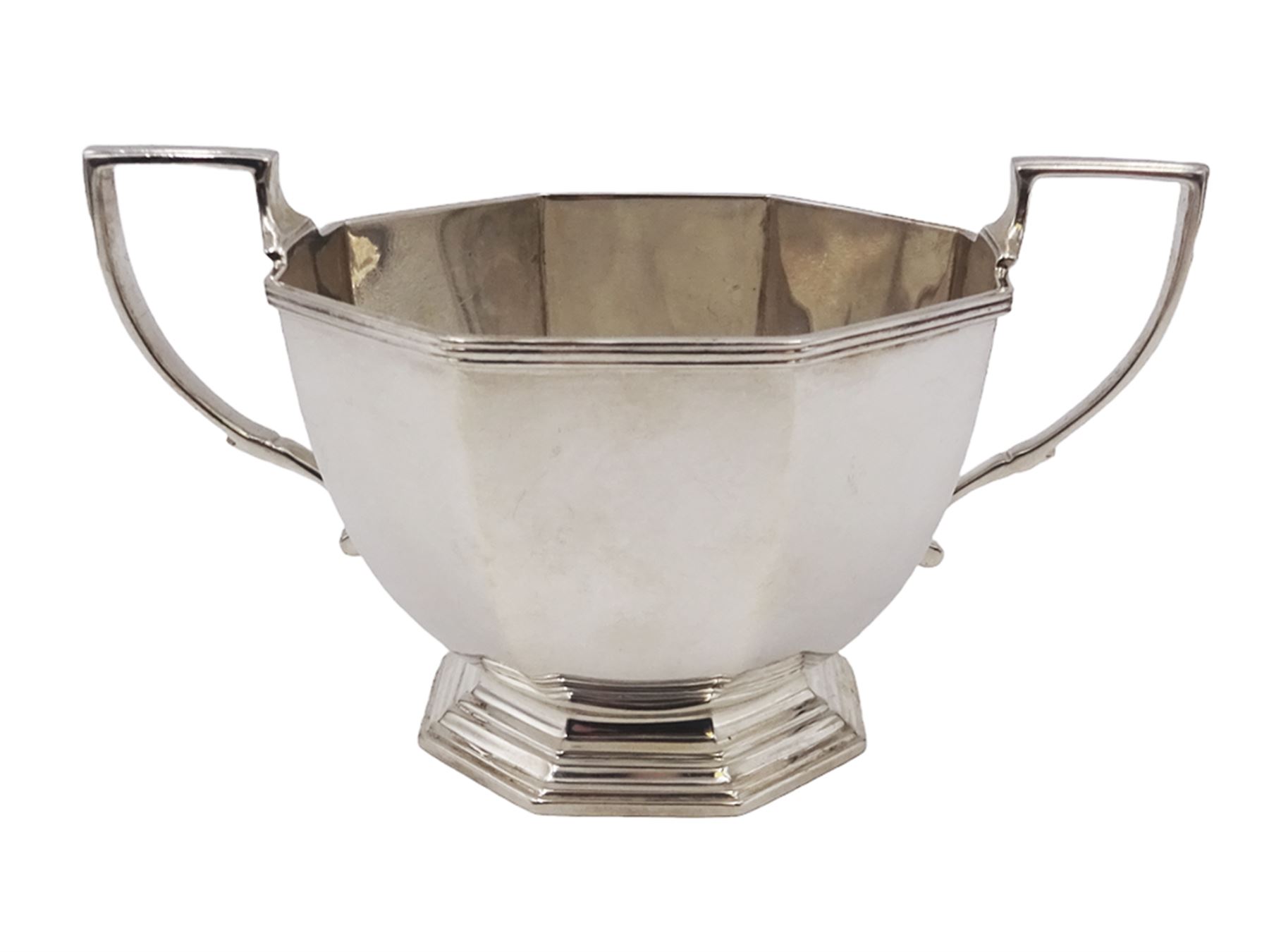 1930s century silver twin handled bowl, of faceted octagonal form with two angular handles, upon a hexagonal foot, hallmarked Mappin & Webb Ltd, Sheffield 1938, including handles H8.5cm