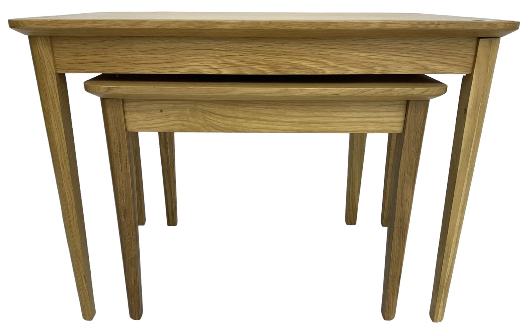 Contemporary light oak nest of two tables, rectangular top over tapering supports