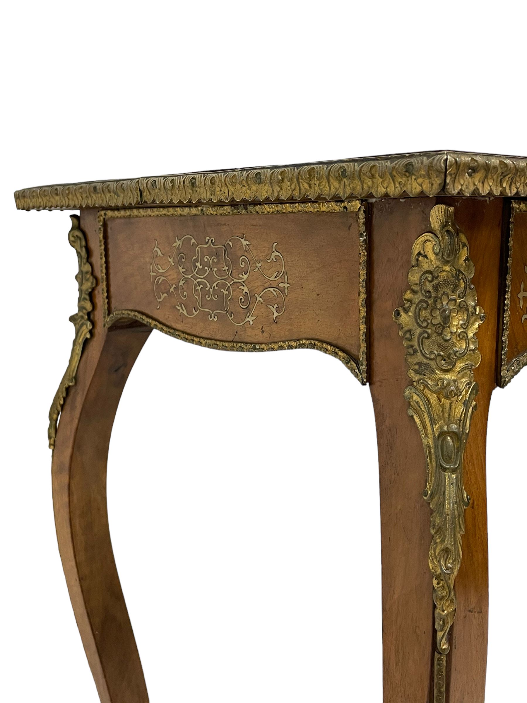 In the manner of Émile Gallé - late 19th to early 20th century inlaid walnut side table, rectangular top inlaid with Japonisme decoration depicting birds within trees, figured crossbanding and cast gilt foliate applied edge, single frieze drawer inlaid with scrolling brass work, on cabriole supports with ornate floral mounts