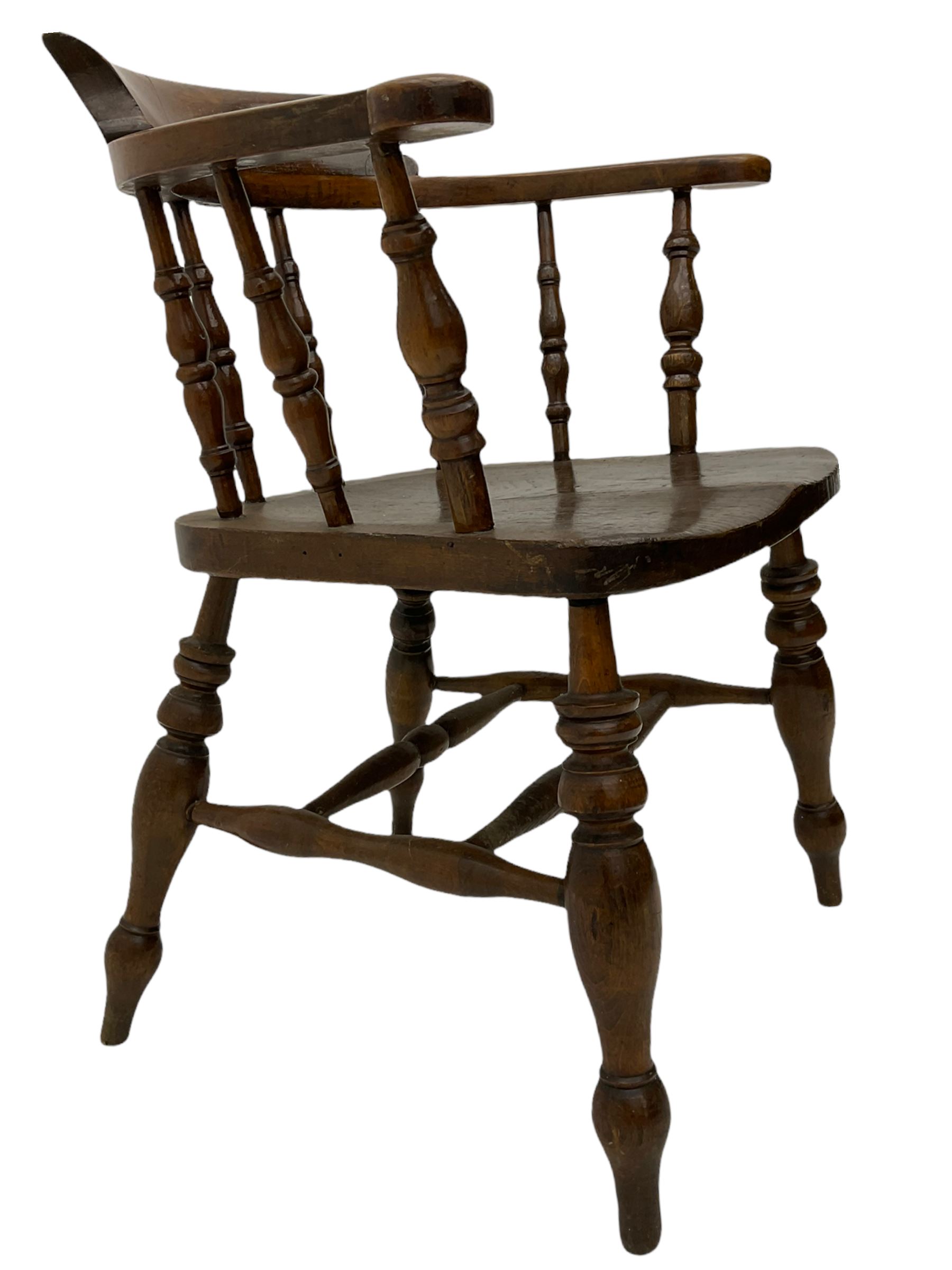 19th century beech and elm smoker's bow armchair, spindle back, turned supports joined by double H stretcher 