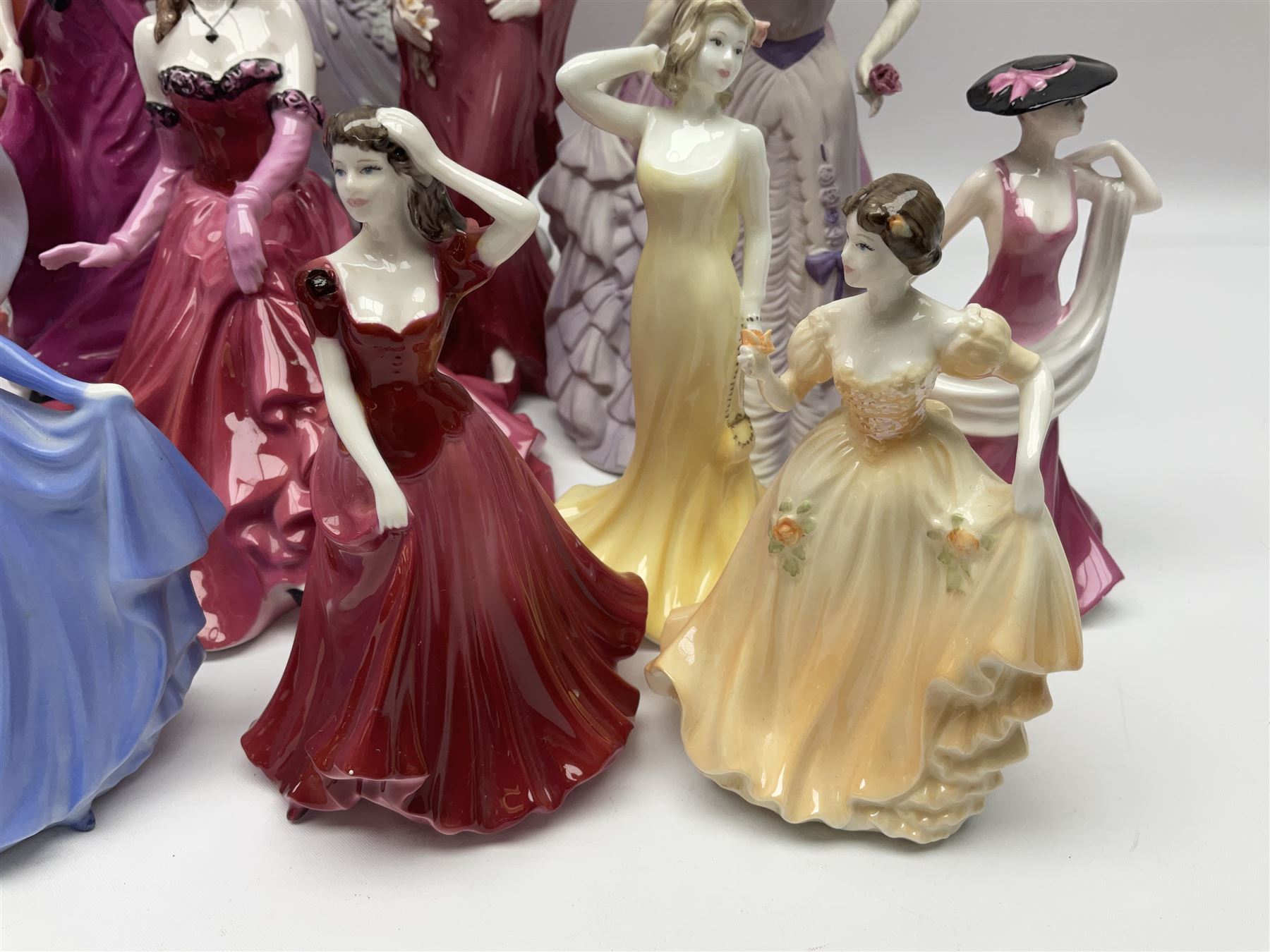 Nine Coalport figures, including Age of Elegance Evening Promenade, The Lovely Lady Christabel and Ladies of Fashion Pamela, together with eight miniature Coalport figures