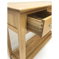 Light oak side console table, three drawers, square supports joined by solid undertier