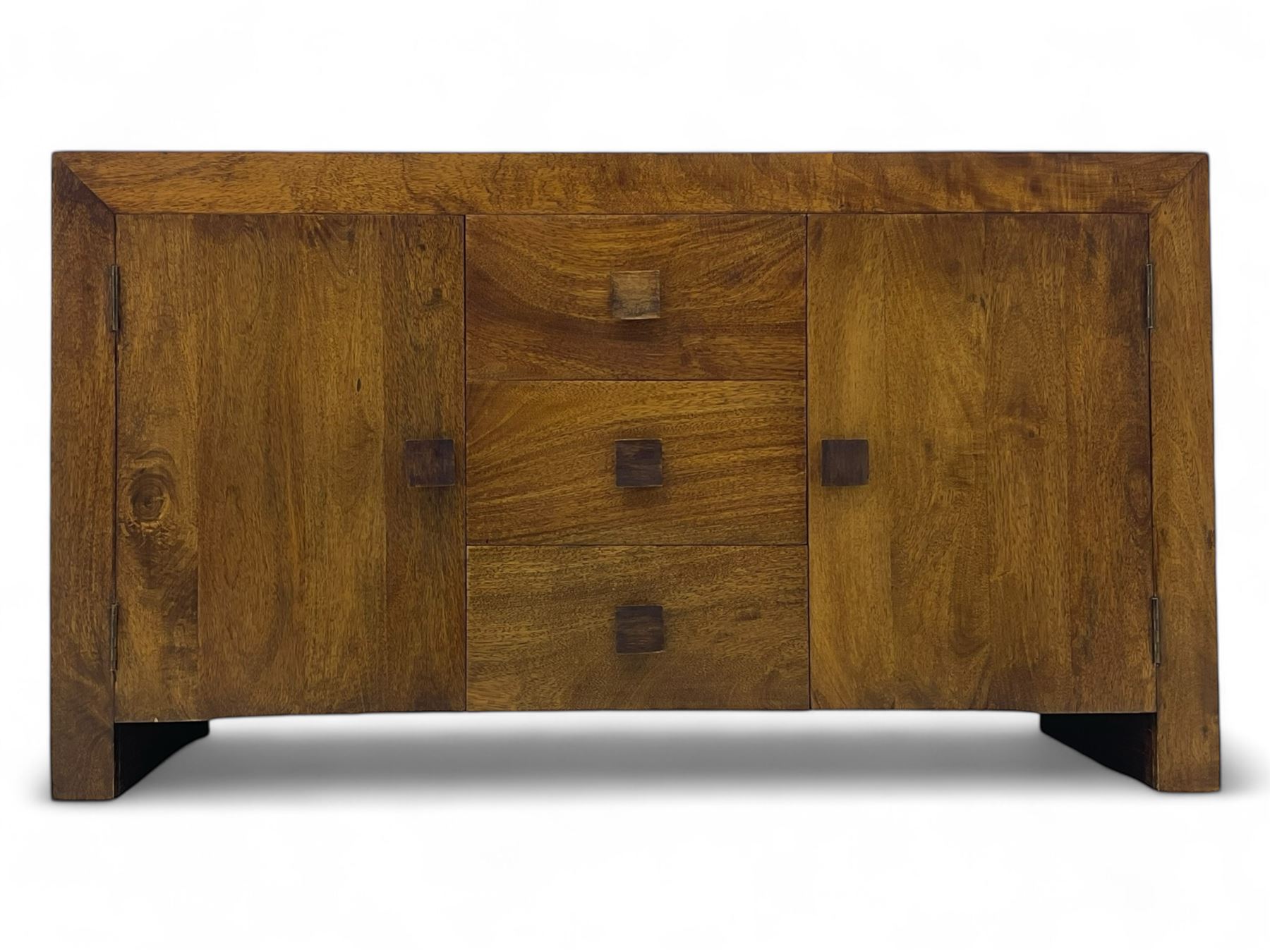 Contemporary Dakota mango wood sideboard, plain rectangular top over three central drawers flanked by cupboards with shelving, each with square pulls, raised on stile supports