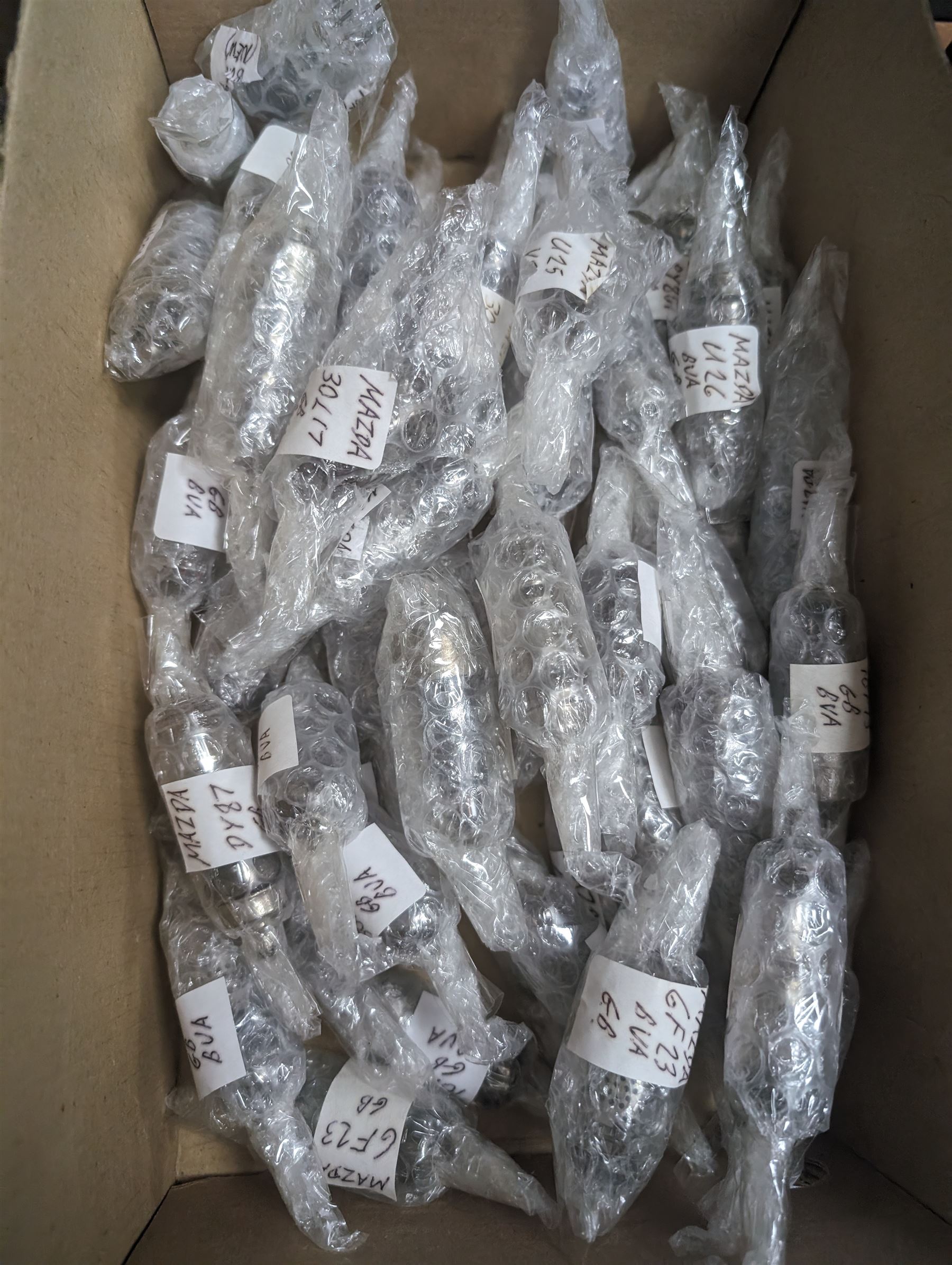 Large collection of Mazda thermionic radio valves/vacuum tubes, including boxed examples and loose bubble wrapped and identified examples