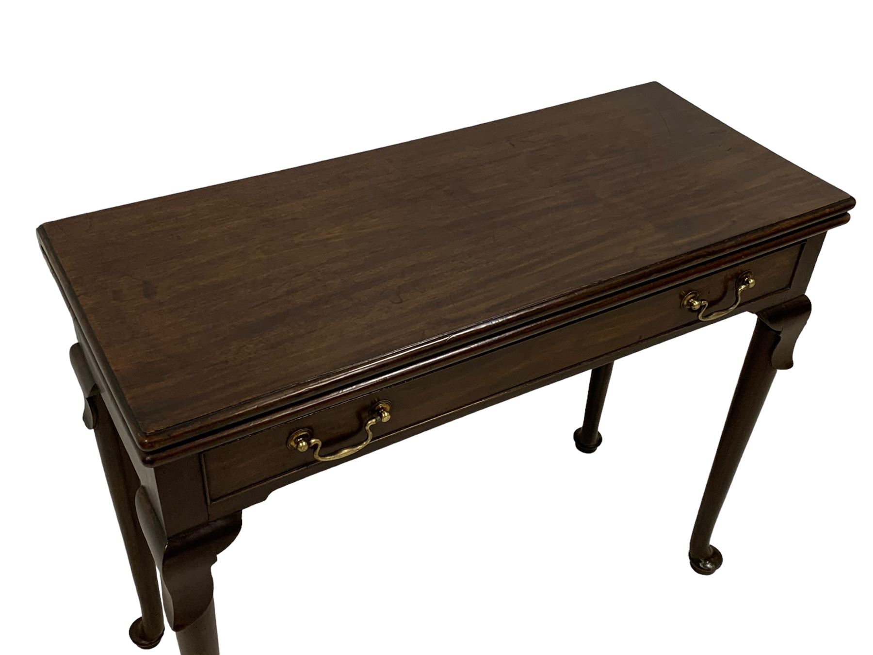 George III mahogany card table, moulded rectangular fold-over top revealing baize lined interior, single cocked-beaded frieze drawer with brass swan neck handles, on lappet carved cabriole supports, double gate-leg action base 