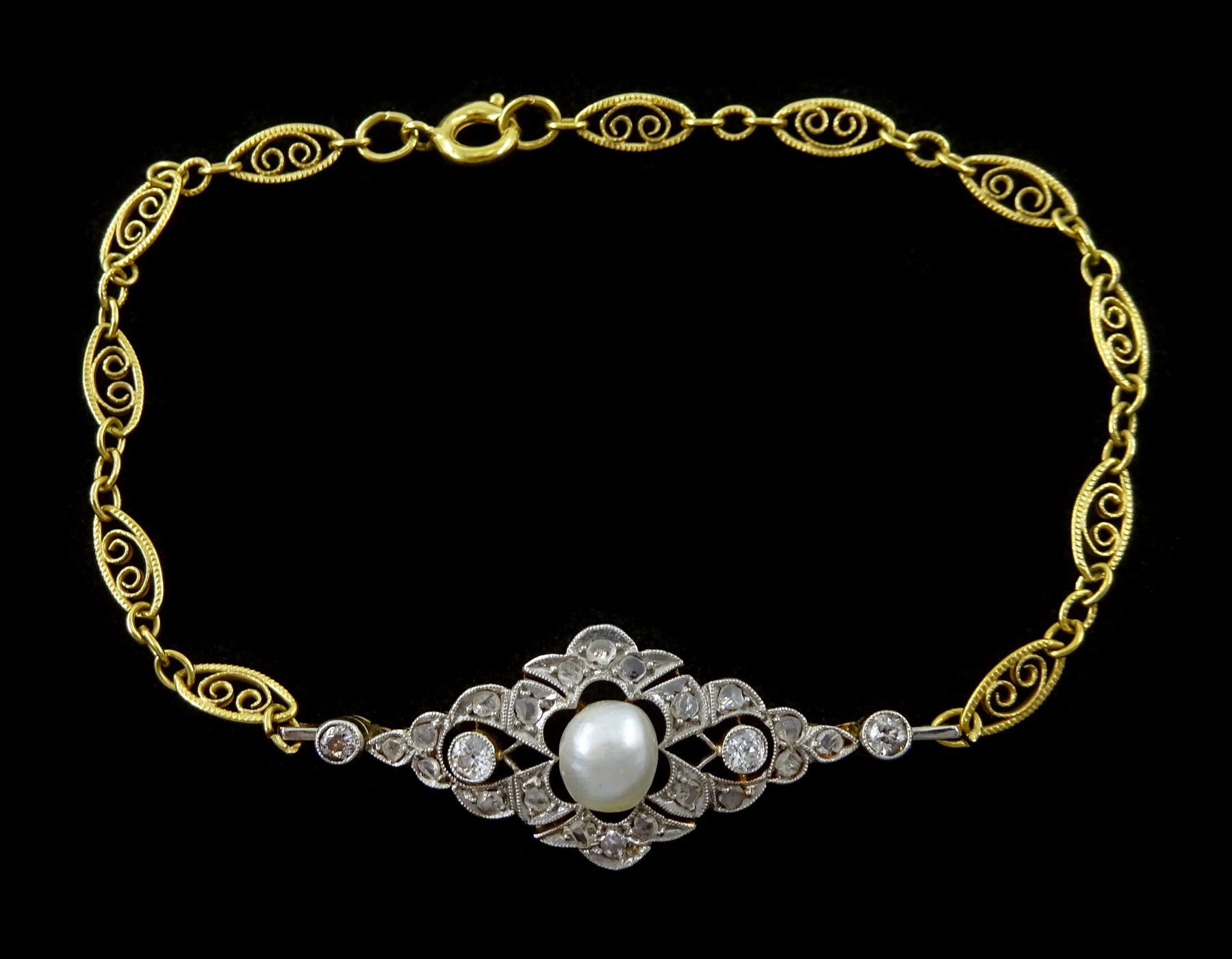 Early 20th century 15ct gold and platinum pearl, old cut and rose cut diamond openwork panel, on later gold-plated wirework bracelet