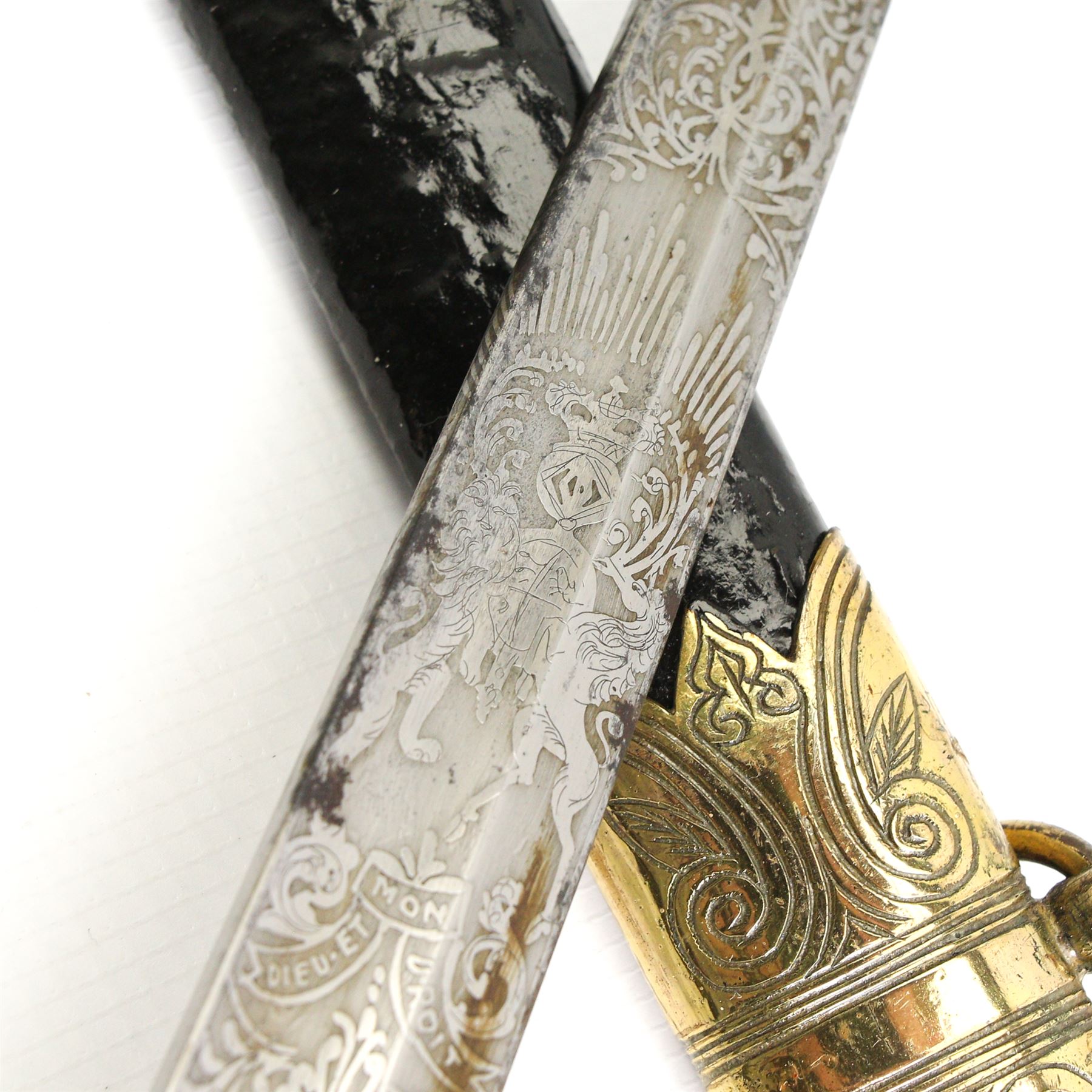 Victorian Naval officers sword by Wilson, King William St., London, the engraved blade with anchor and coat of arms, brass hilt with lion's head pommel and wire wound shagreen grip, blade length 75cm, brass and black leather scabbard