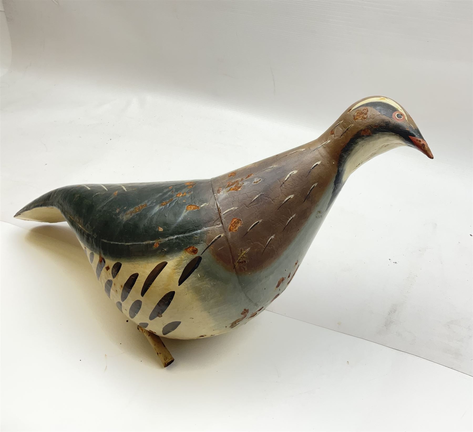 Early 20th century cold painted metal decoy bird, modelled as a Partridge, H34cm L55cm