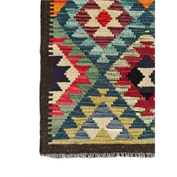 Maximana Kilim ground rug, the field decorated with a geometric pattern of multi-coloured diamonds and triangles, each containing stylised motifs, enclosed by a plain brown border