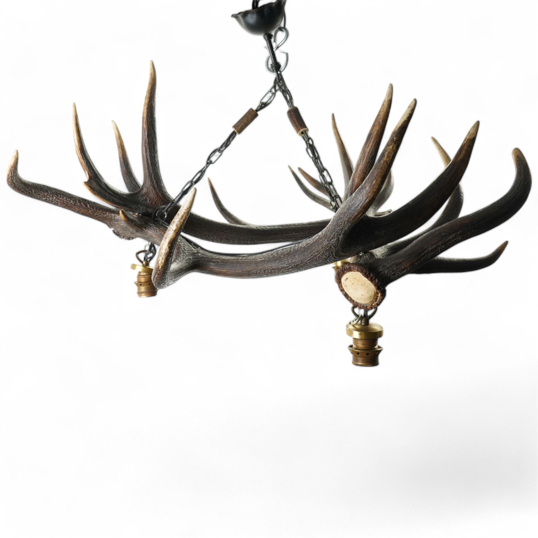 Deer antler chandelier, of triangular form, with three fitted hanging lights H45cm