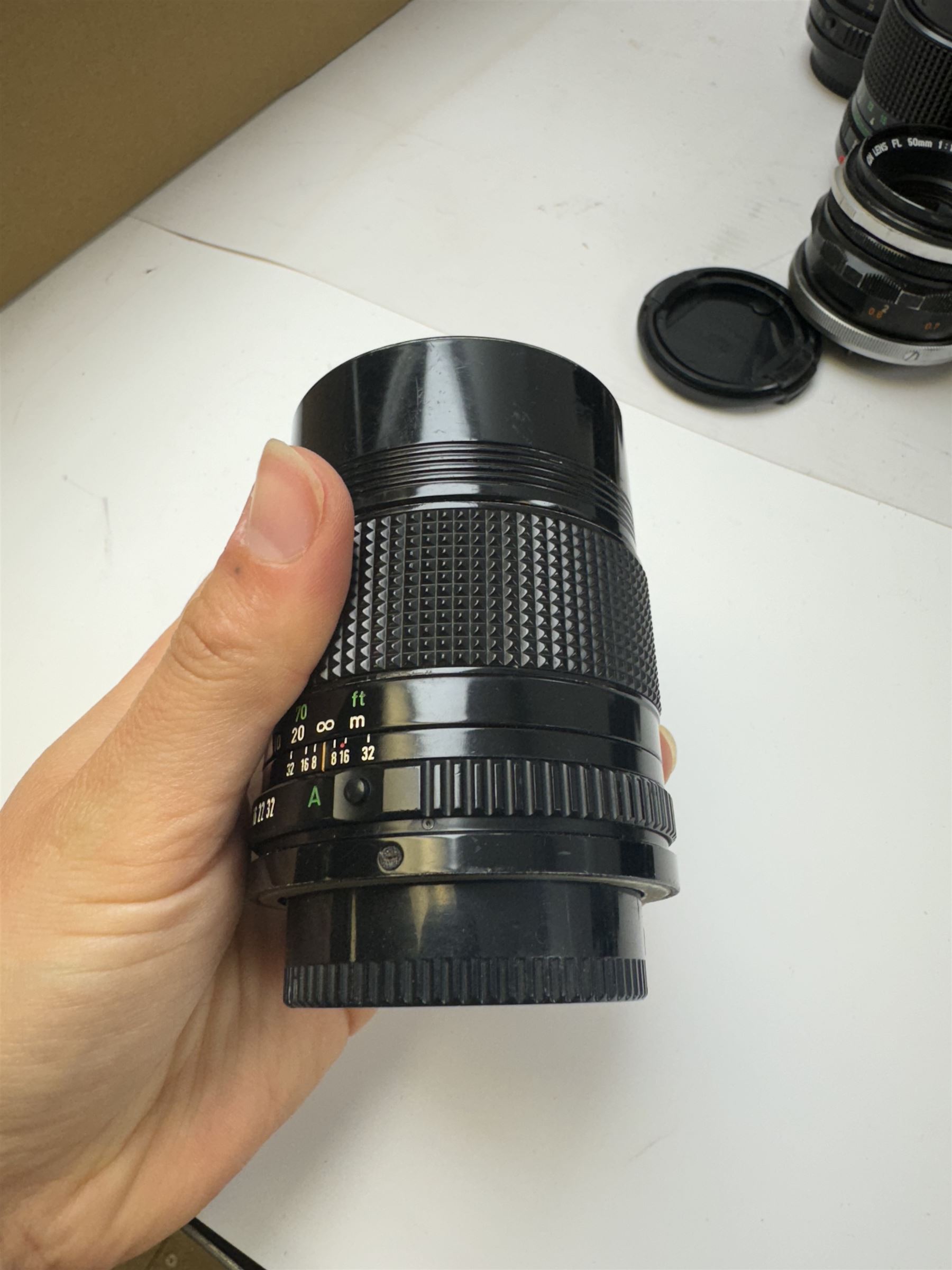 Seventeen Canon camera lenses, mostly FD examples, including 28-85mm 1:4 serial no, 49881, 35-105mm 1:3.5-4.5 serial no. 87632 and 135mm 1:2.8 serial no. 48336, one boxed