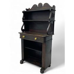 Victorian scumbled pine chiffonier, raised shaped back fitted with two shelves on S-scroll supports, rectangular top with rounded corners over single frieze drawer and open shelf, on projecting rounded sledge platforms and compressed bun feet, scumbled to resemble rosewood 