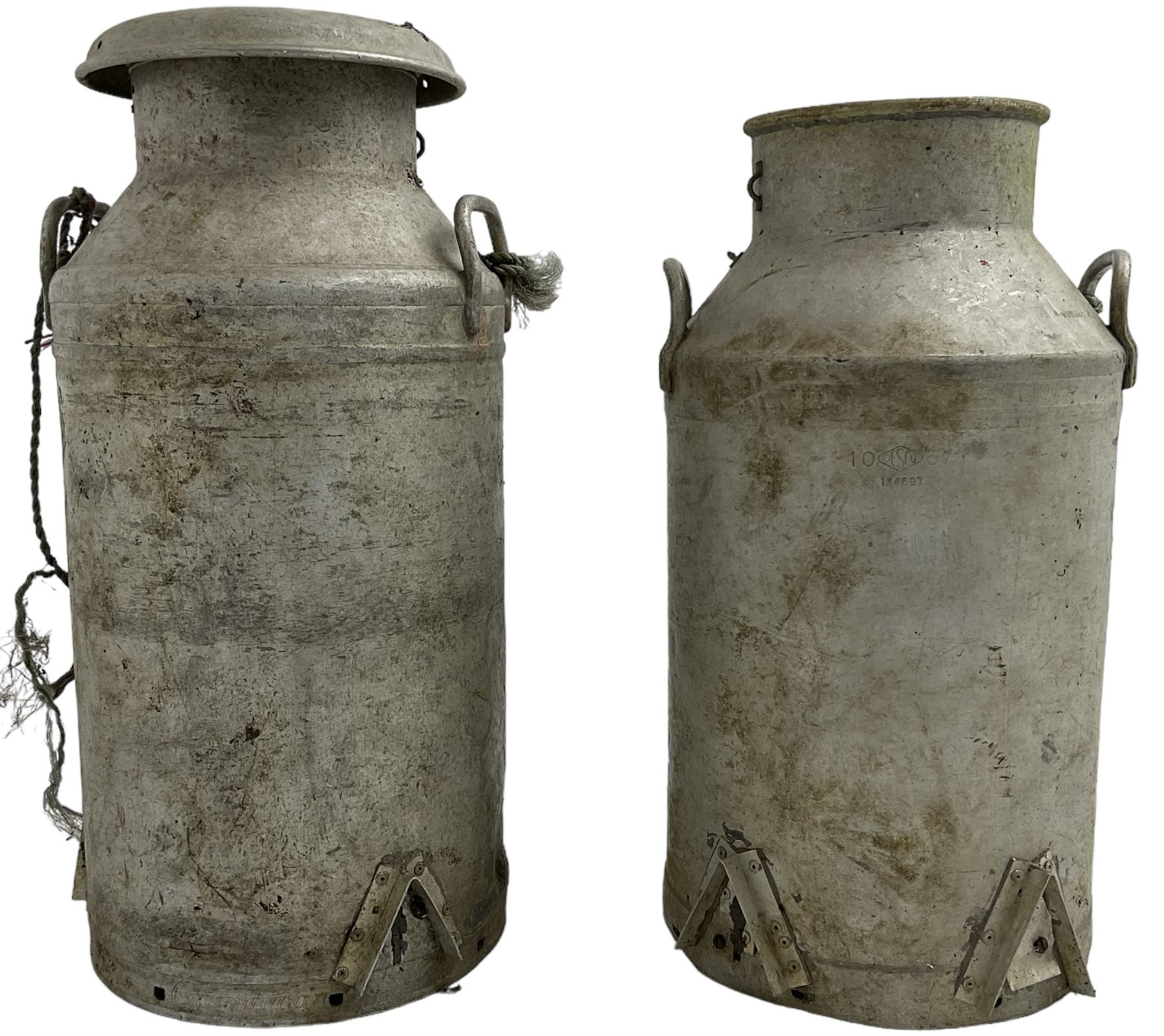 Near pair of antique aluminium milk churns with twin handles, one with Grundy Teddington lid