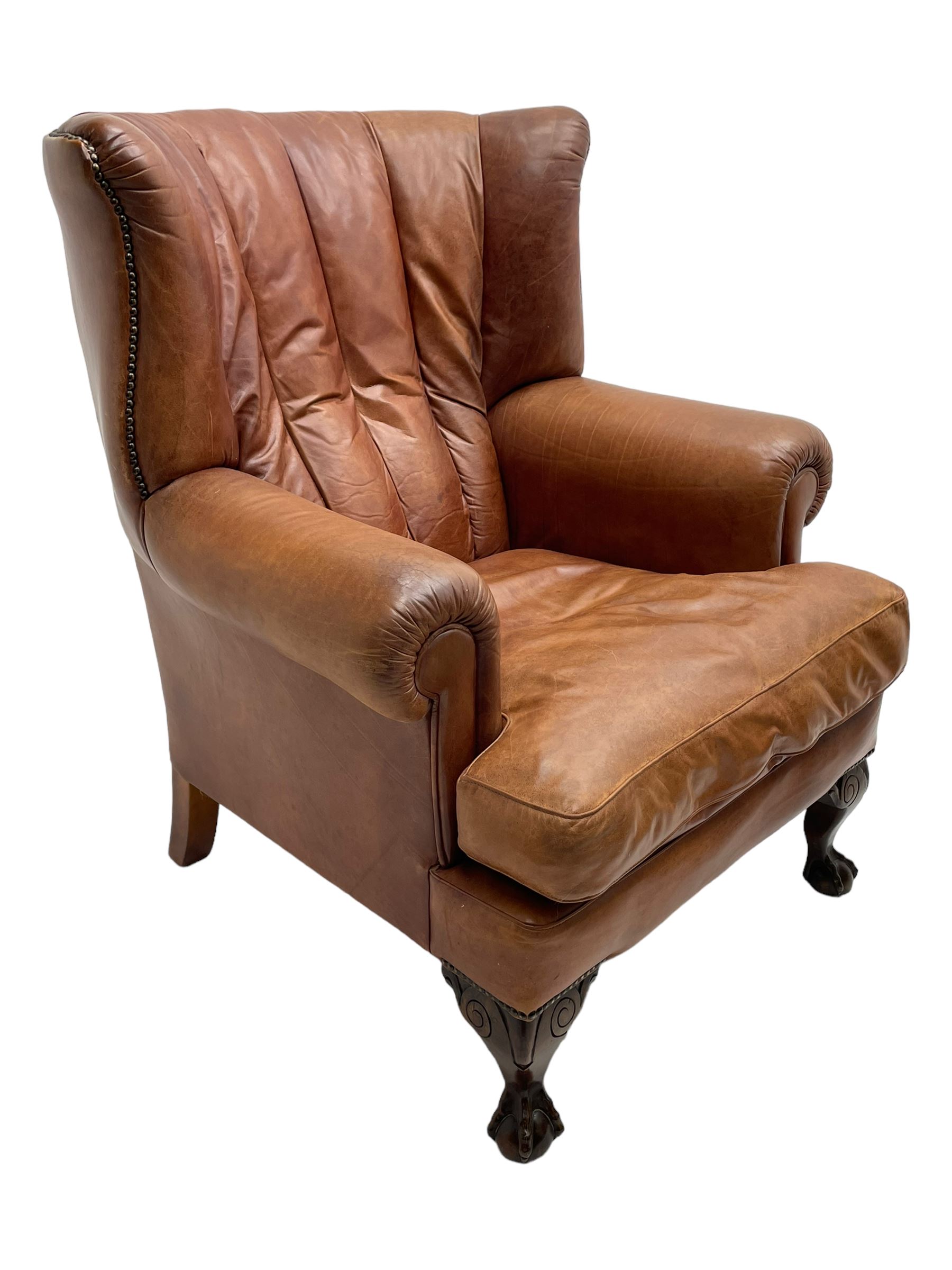 Tetrad - 'Blake' club armchair, fanned wingback and rolled arms upholstered in tan brown leather, on ball and claw carved cabriole feet 