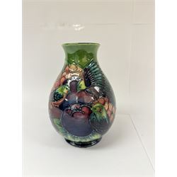 Moorcroft vase of baluster decorated in the Finches pattern with green ground, designed by Sally Tuffin, with makers mark beneath, H20cm