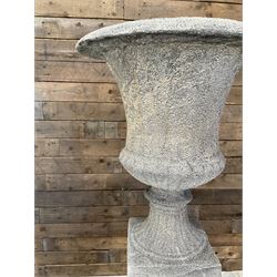 Pair of large Georgian design cast stone garden urns, egg and dart border, tapering column on square base, raised on square column