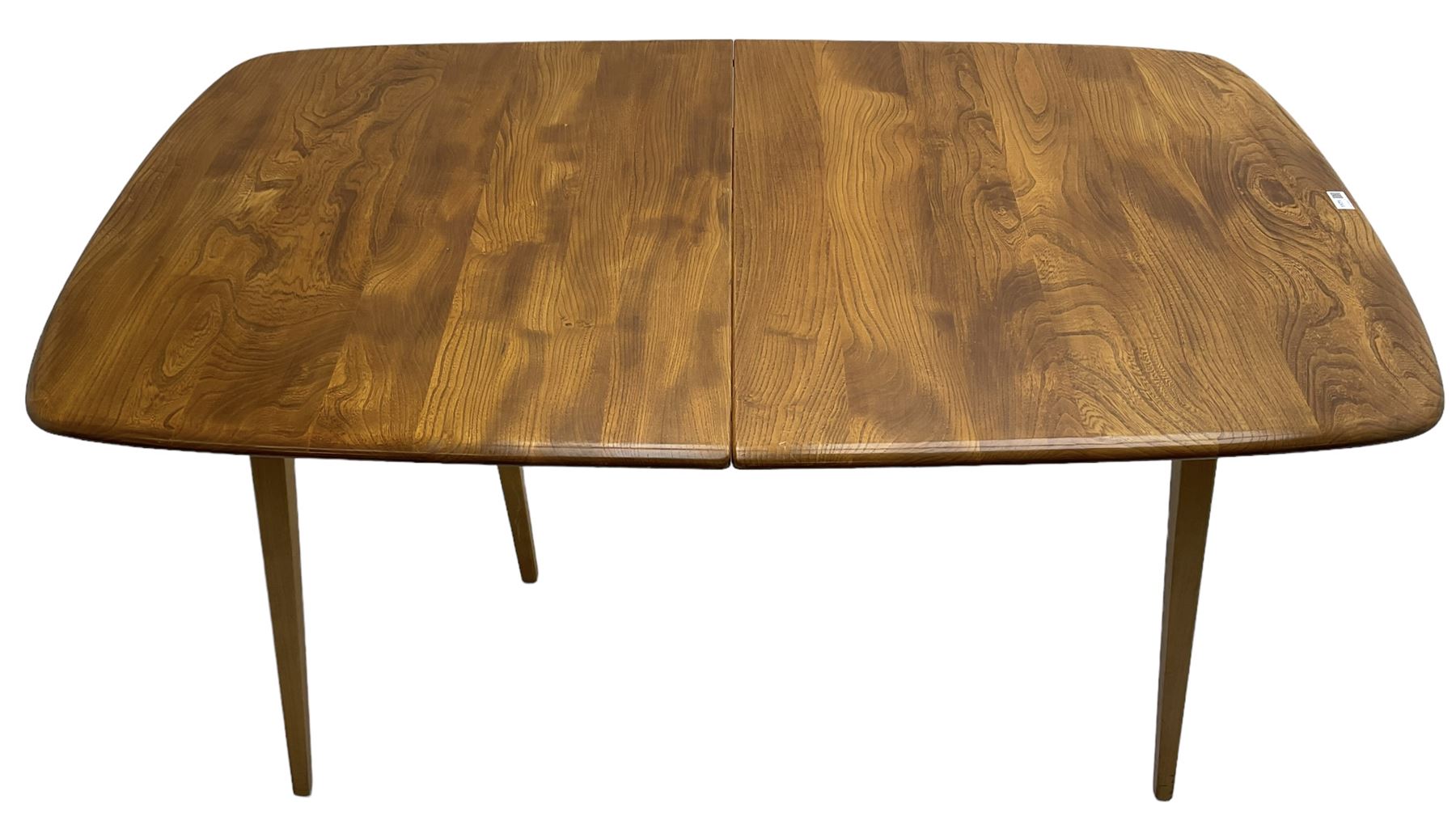 Ercol - light elm and beech 'Slide Leg Expanding Dining Table (444)', rectangular top with rounded corners, raised on tapered splayed supports, with two additional leaves