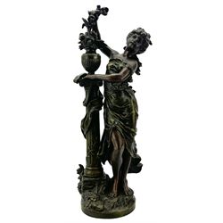 After L & F Moreau - Spelter table lamp in the form of a female figure next to a pedestal on circular naturalistic base H55cm