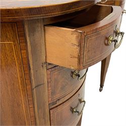 Edwardian mahogany and satinwood banded kidney-shaped writing desk, the shaped top with figured mahogany banding and boxwood stringing, fitted with seven drawers with satinwood bandings, on square tapering supports with brass and ceramic castors