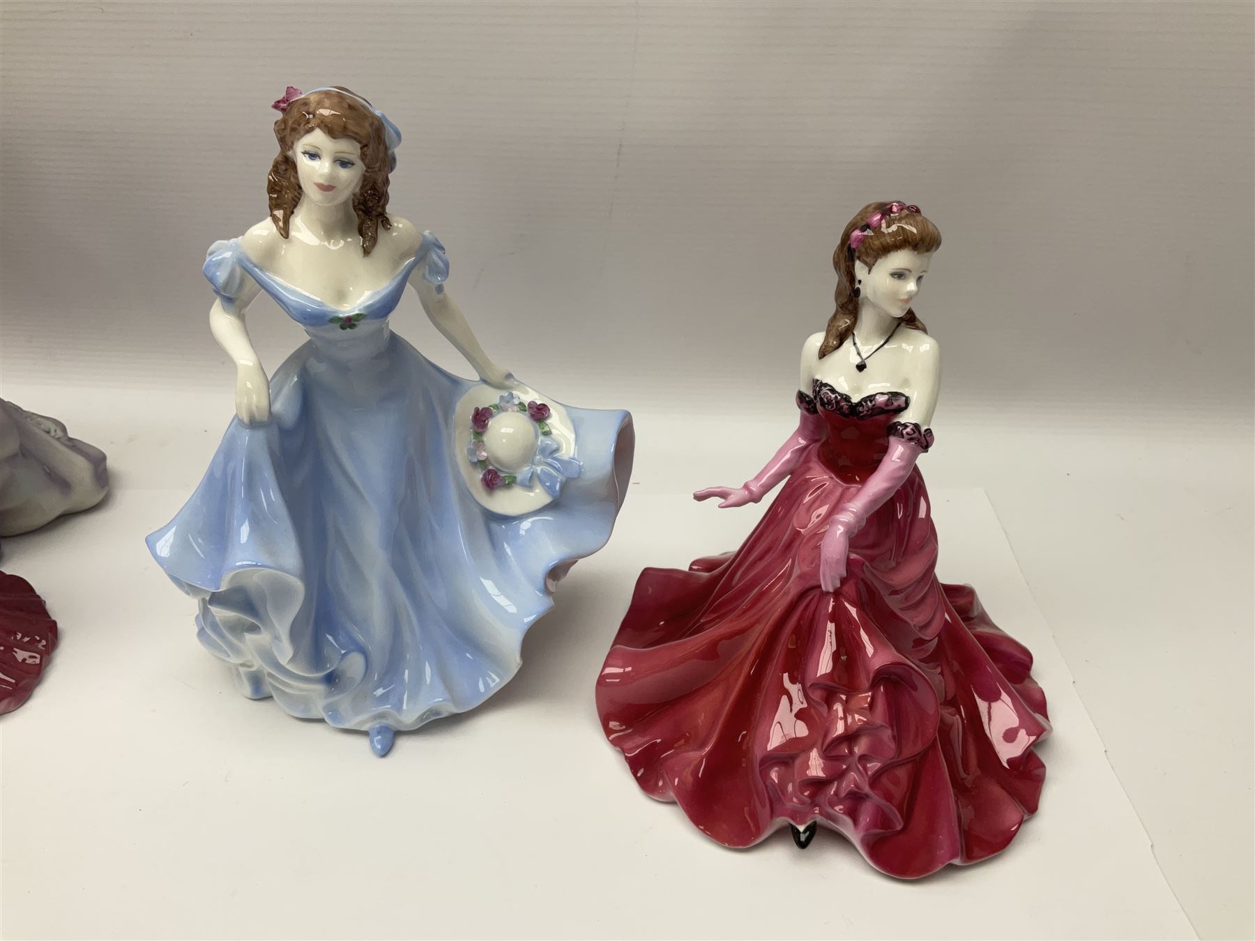 Nine Coalport figures, including Age of Elegance Evening Promenade, The Lovely Lady Christabel and Ladies of Fashion Pamela, together with eight miniature Coalport figures