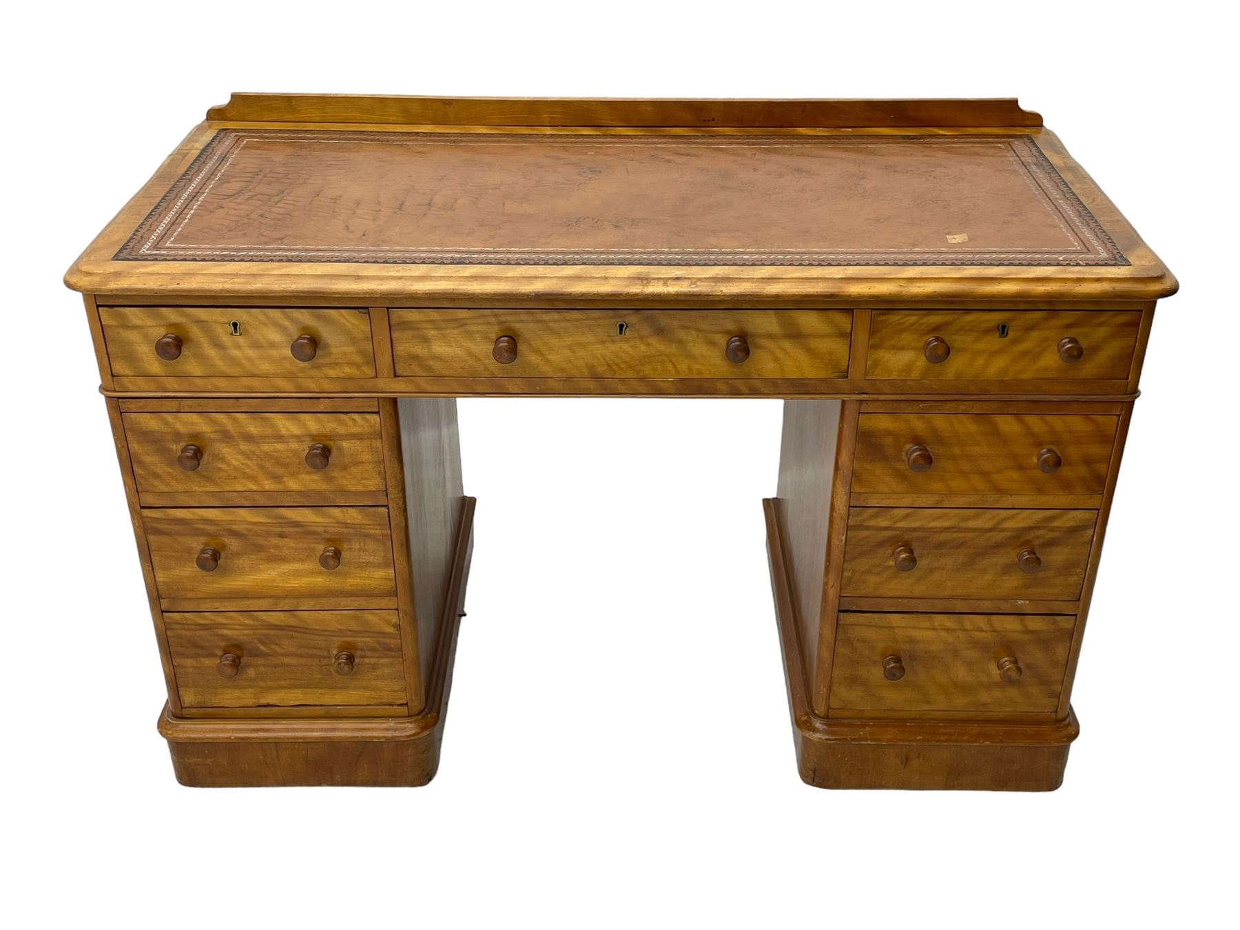 Victorian satin walnut twin pedestal desk, moulded rectangular top with rounded corners and raised back, inset leather writing surface with tooled borders, fitted with nine drawers with turned handles, on moulded plinth base 