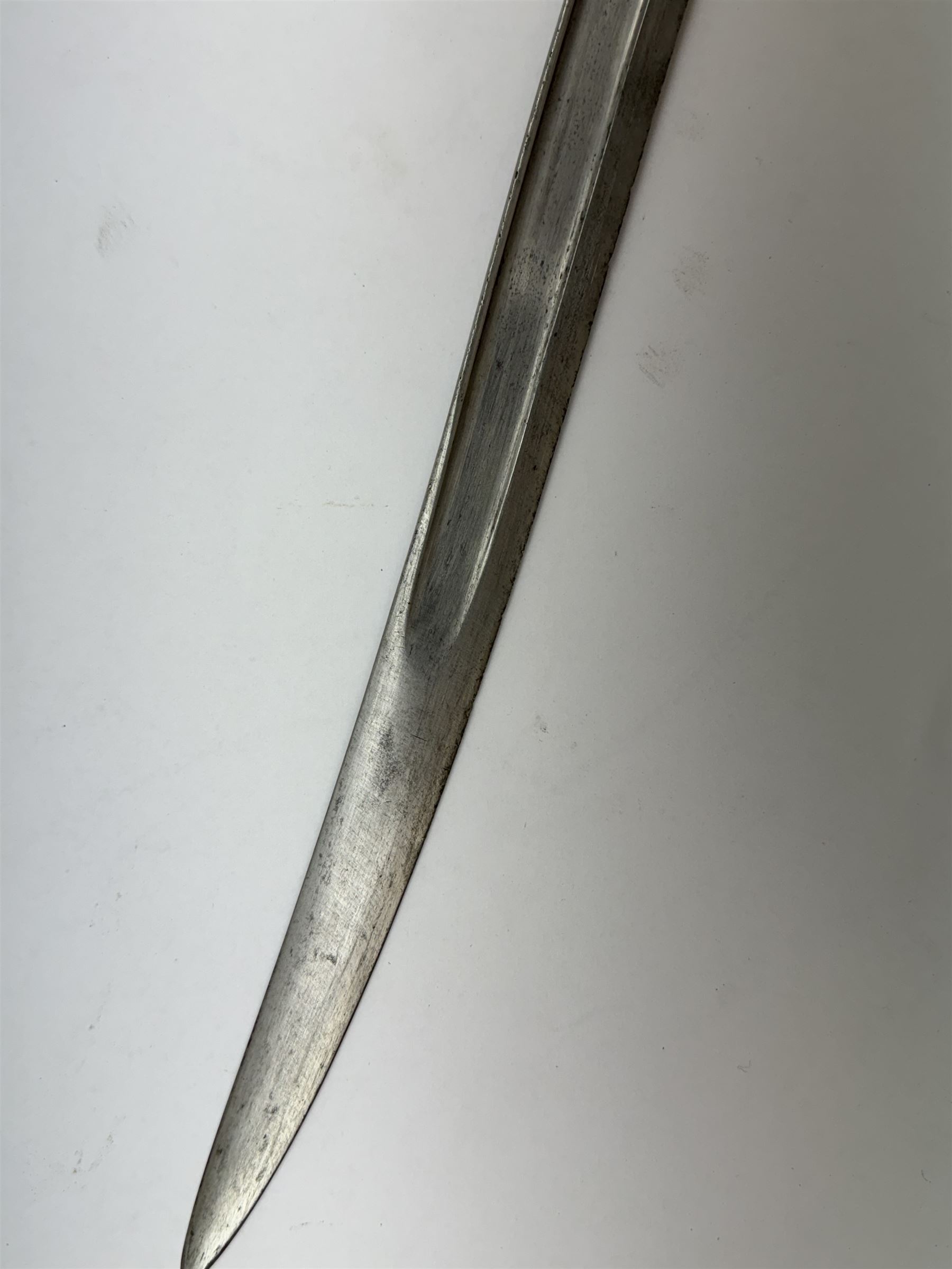 WWI French Chassepot Sword bayonet 57cm steel blade inscribed to the back-edge 'Tulle Juillet 1874', the cross-guard with indistinctly impressed number, in its steel scabbard, L71cm