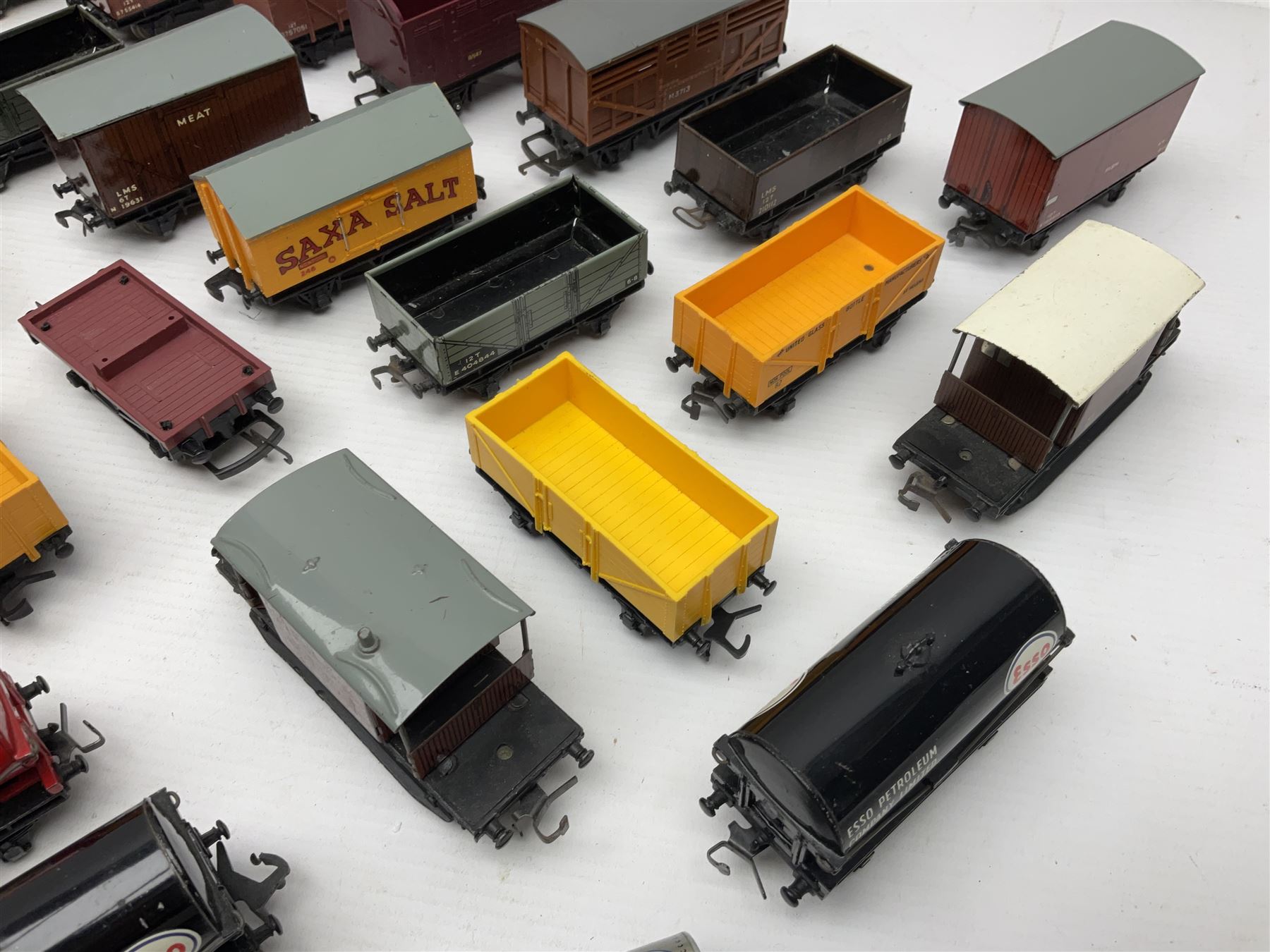 Hornby Dublo - forty-three goods wagons including nine tank wagons (Esso, Mobil, Vacuum, UD and Traffic Services), brake vans, meat and fish wagons, bogie well and bolsters, cable drums, open wagons, salt and grain wagons, etc; and six others by Tri-ang etc; all unboxed (49)