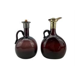 Late 19th/ early 29th century Continental ruby glass claret jug with white metal hinged cover H20cm and an amethyst glass claret jug H19cm (2)